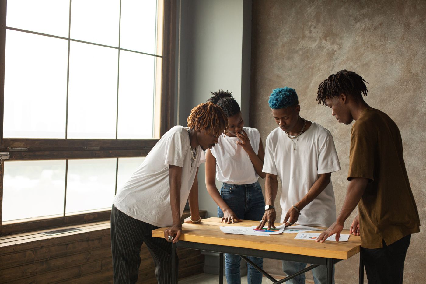Black colleagues reviewing a project at a table
